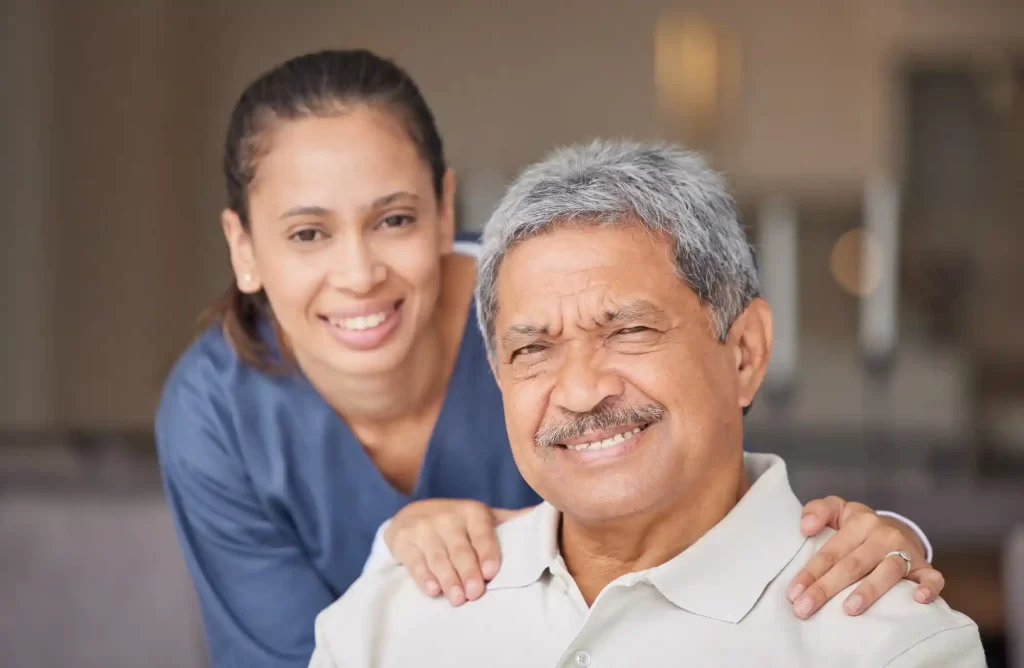 portrait-of-elderly-man-with-a-nurse-bonding-during-a-checkup-at-assisted-living-homecare-smile-